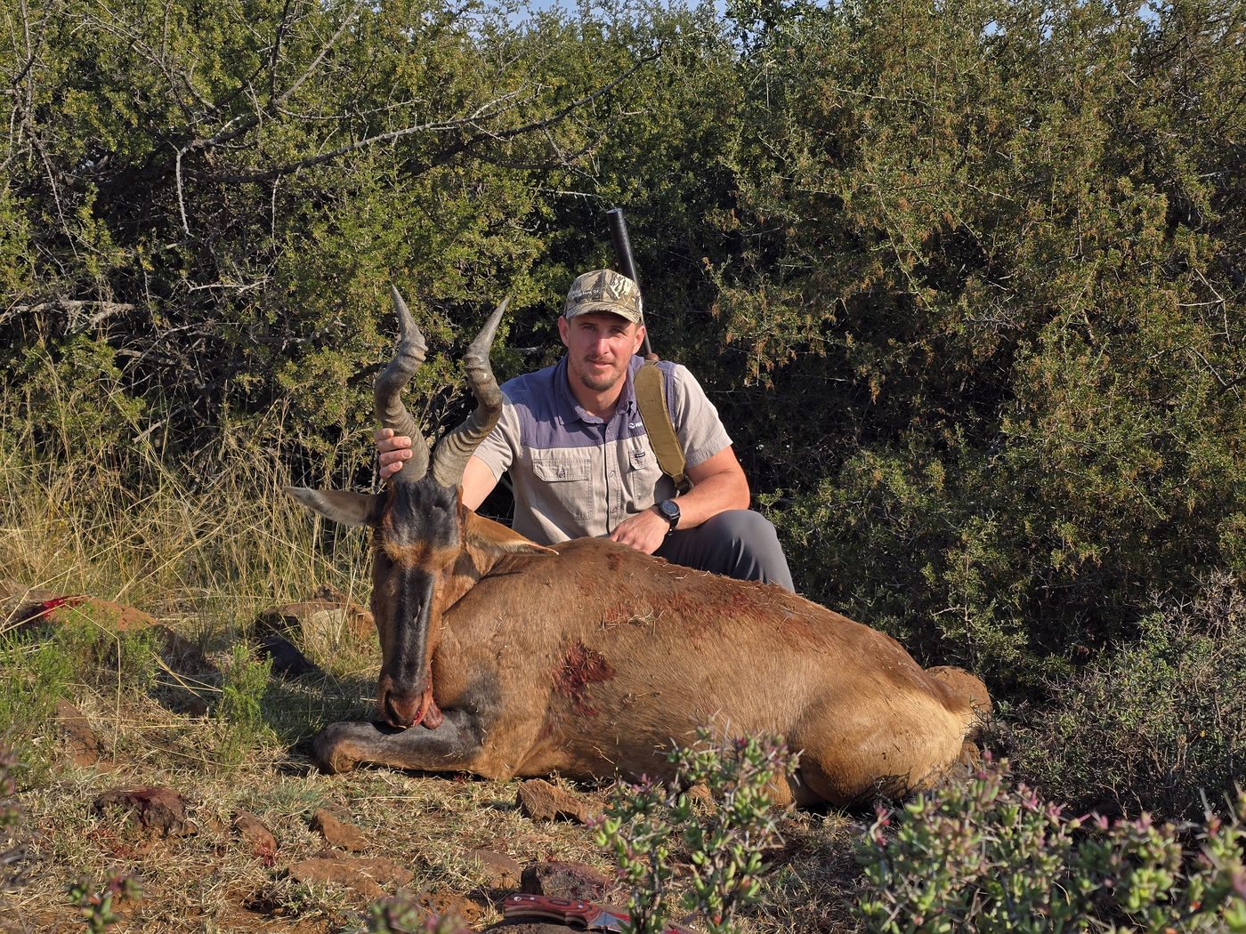 Hunter with a red hartebeest trophy at Jericho